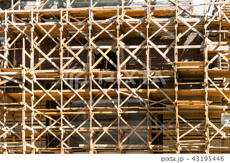 wooden scaffolds on multi-storey building 43195446