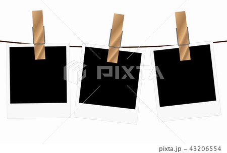 Three blank polaroid frames hanging on a rope 43206554