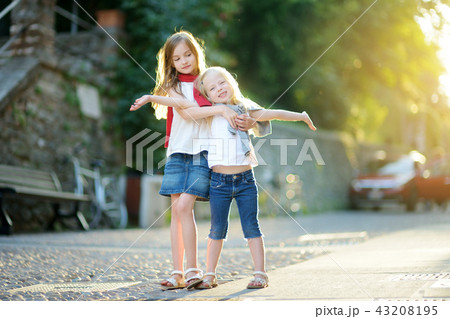 Two adorable little sisters having fun together 43208195