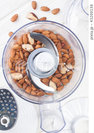 almonds in a food processor ready to be crushed 43209138