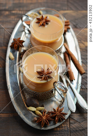 Indian masala chai tea. Spiced tea with milk. 43213902