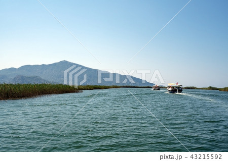 Boat trip along rocky green coast in Turkey shot 43215592
