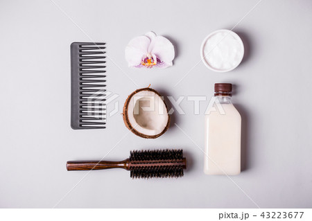 Coconut oil and and combs. Hair care concept Coconut oil and and combs. Hair care concept 43223677