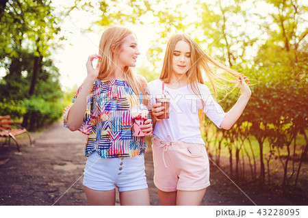 Trendy teen women with drinks 43228095