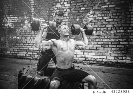 Two muscular athletes training 43228988