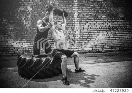 Two muscular athletes training 43228989