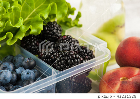 Berries in lunch box and fruits 43231529