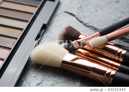 brush makeup products on dark background 43232445