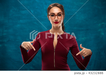 Beautiful young woman posing in studio 43232886