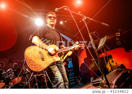 Band performs on stage in a nightclub 43234622