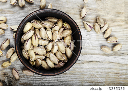 pistachios in a clay plate 43235326