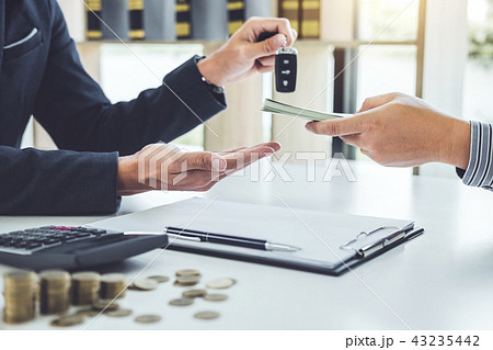 Salesman send key to customer after good deal agreement and rece 43235442