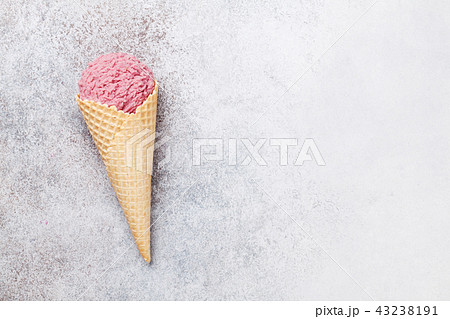 Ice cream cone with berry scoop Ice cream cone with berry scoop 43238191