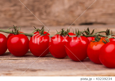 Bunch of shiny cherry tomatoes, close up. 43239234