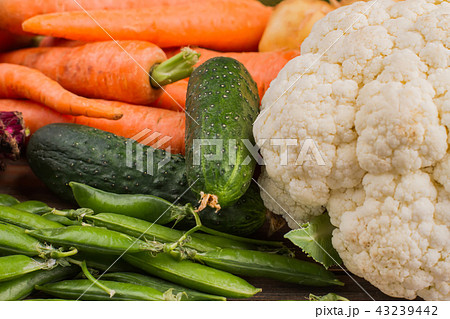 Cauliflower, cucumber, peas and carrots. 43239442