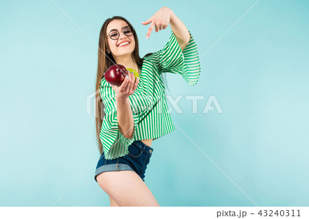 Young woman with two apples Young woman with two apples 43240311