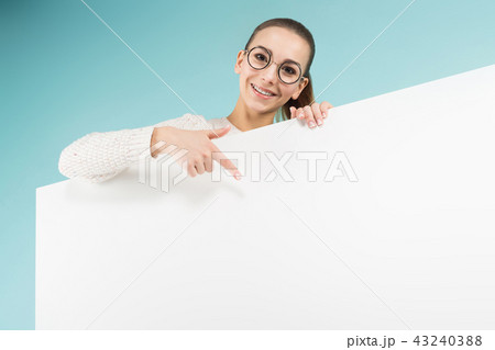 Attractive young woman with blank banner 43240388