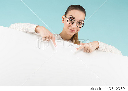 Attractive young woman with blank banner Attractive young woman with blank banner 43240389