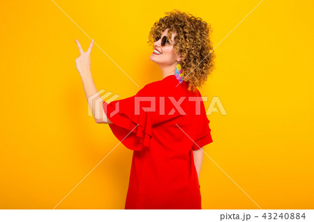 Attractive woman with short curly hair 43240884