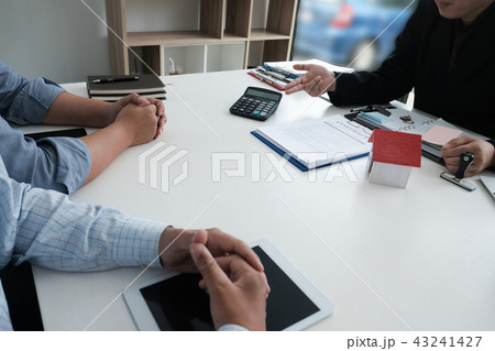real estate agent have meeting with customer. sale & purchase property with house model signing contract document. realtor talk with client. 43241427