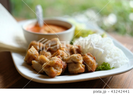 minced pork sausage, fermented rice noodle & vegetable served with chili sauce. vietnamese food called Nem Nuong Xa minced pork sausage, fermented rice noodle & vegetable served with chili sauce. vietnamese food called Nem Nuong Xa 43242441