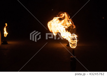Burning Torch in the Night at black background Burning Torch in the Night at black background 43245762