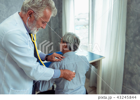 Portrait of senior doctor is examining physical  43245844