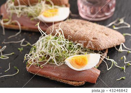 Marinated herring with egg and vegetables sandwich Marinated herring with egg and vegetables sandwich 43246842
