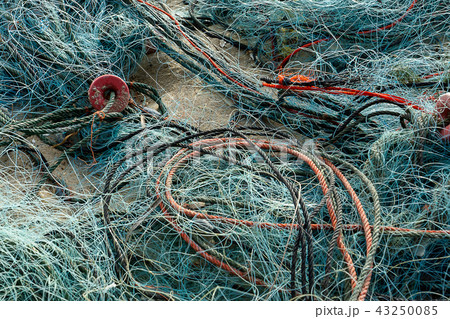 Old fishing net on the beach. 43250085