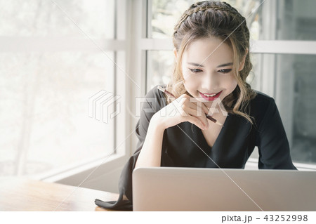Freelancer Woman working online at her home. Freelancer Woman working online at her home. 43252998