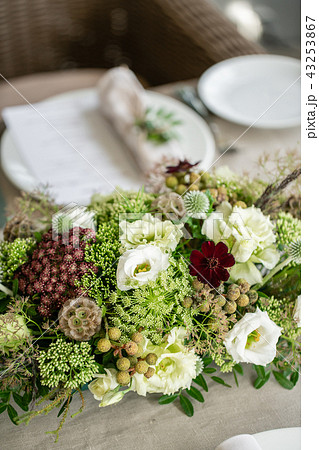 Wedding flower arrangement of flowers and greensin glass vase. Close up. Selective focus. Wedding Wedding flower arrangement of flowers and greensin glass vase. Close up. Selective focus. Wedding 43253867