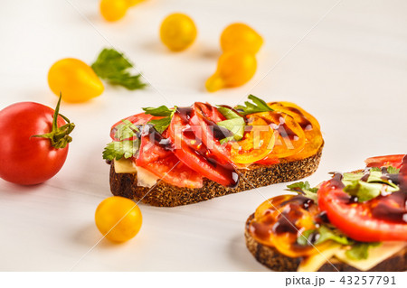 Sandwiches with tomatoes and cheese Sandwiches with tomatoes and cheese 43257791
