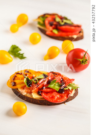 Sandwiches with tomatoes and cheese Sandwiches with tomatoes and cheese 43257792