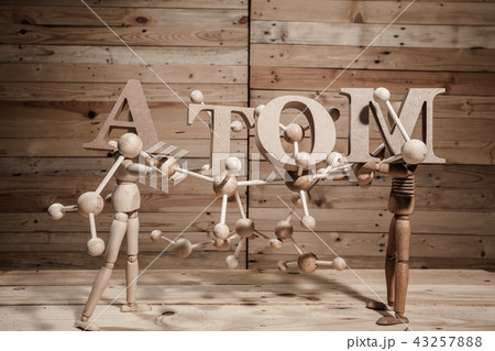 wooden puppets with atom word wooden puppets with atom word 43257888