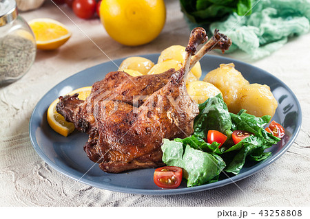 Duck legs confit with boiled potatoes Duck legs confit with boiled potatoes 43258808