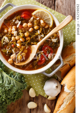 Vegetable stew of chickpeas, kale, tomato, garlic Vegetable stew of chickpeas, kale, tomato, garlic 43259092