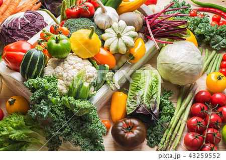 Summer vegetables on white table Summer vegetables on white table 43259552