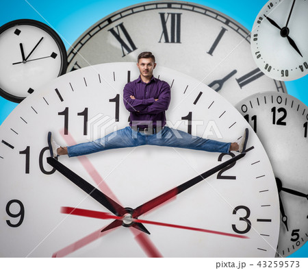 Man sitting on the twine between arrows of clock 43259573