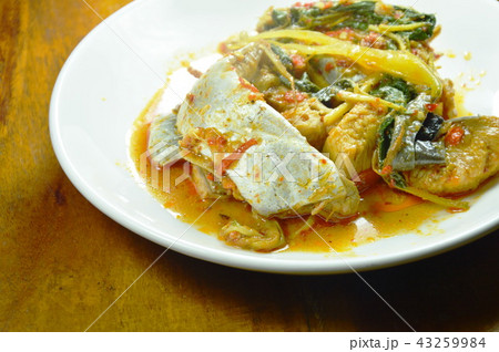 spicy fried striped catfish with herb and curry  43259984