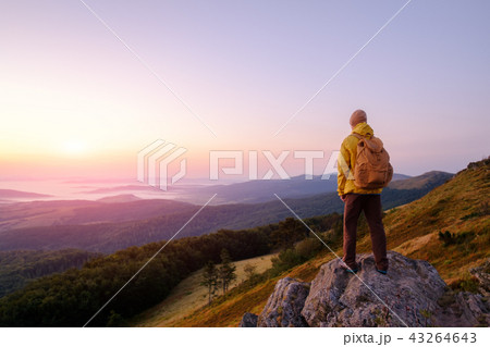 Alone tourist on the edge of the cliff 43264643