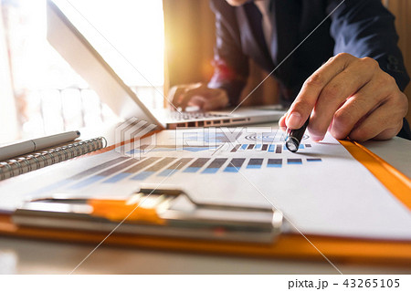 businessman hand working with finances about cost businessman hand working with finances about cost 43265105