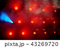 Several red stage lights in the dark 43269720