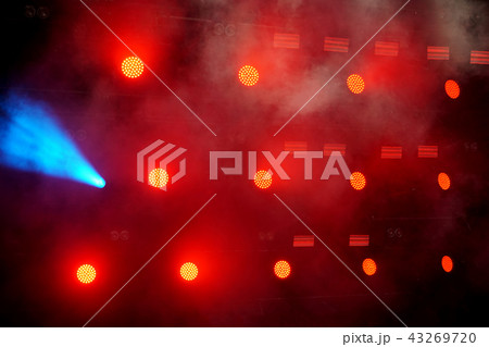 Several red stage lights in the dark Several red stage lights in the dark 43269720