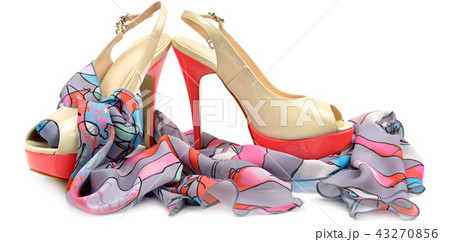 Elegant sandals and scarf isolated on white . Elegant sandals and scarf isolated on white . 43270856