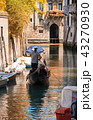 Gondola sails in a canal in autumn day in Venice 43270930