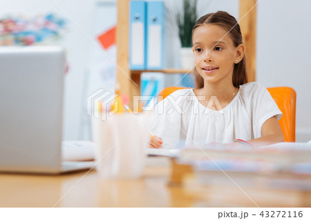 Nice cute girl sitting in a light cozy room 43272116