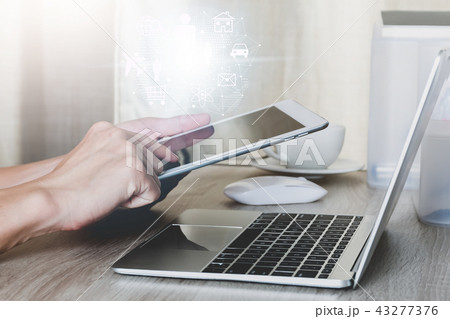 Internet of things concept,Man using tablet with modern technologies business and technology concept 43277376