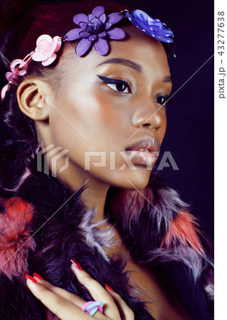 young pretty african american woman in spotted fur coat and flow 43277638