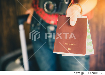Passengers hold passports and travel Passengers hold passports and travel 43280167
