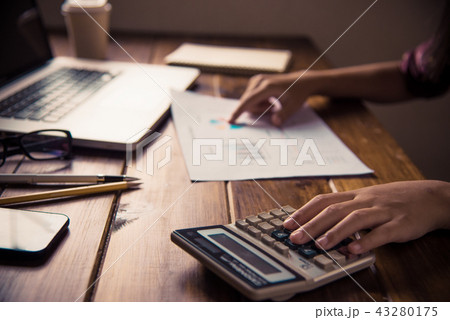 Business team working with laptop in open space 43280175